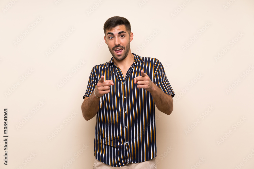 Handsome man with beard over isolated background points finger at you Handsome man with beard over isolated background points finger at you