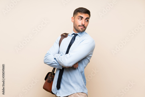 Young business with beard over isolated background laughing