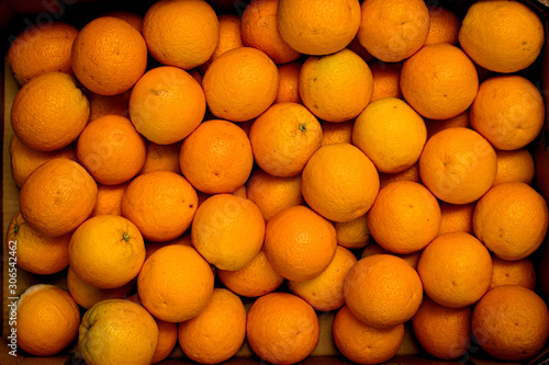 box of fresh oranges for background and copy space