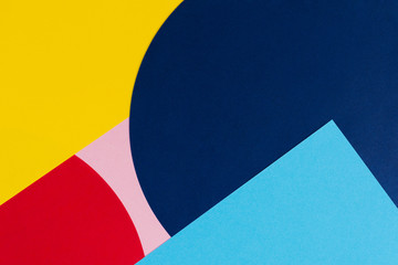 Texture background of fashion papers in memphis geometry style. Yellow, blue, light blue, red and pastel pink colors. Top view, flat lay