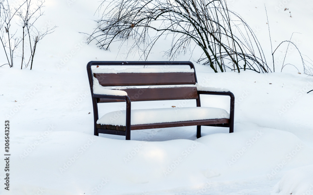 bench covered with white snow