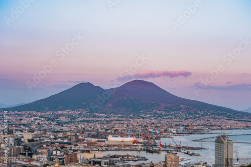 Sunset view of Mont Vesuvius volcano with Naples city in the foreground