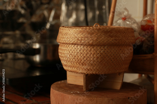 A container for glutinous rice of Thai people living in the north and northeast region. photo