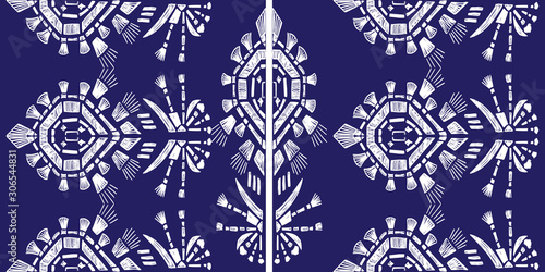 Drapery ikat navajo motif etnic white tribal ornamentalpattern on blue background. Surface background design for cotton fashion. Textile fabric ornament future rug. photo