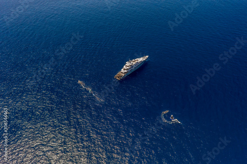 Aerial high-angle drone shot of luxury yacht in Tyrrhenian sea near Capri Island in summer © Davidzfr