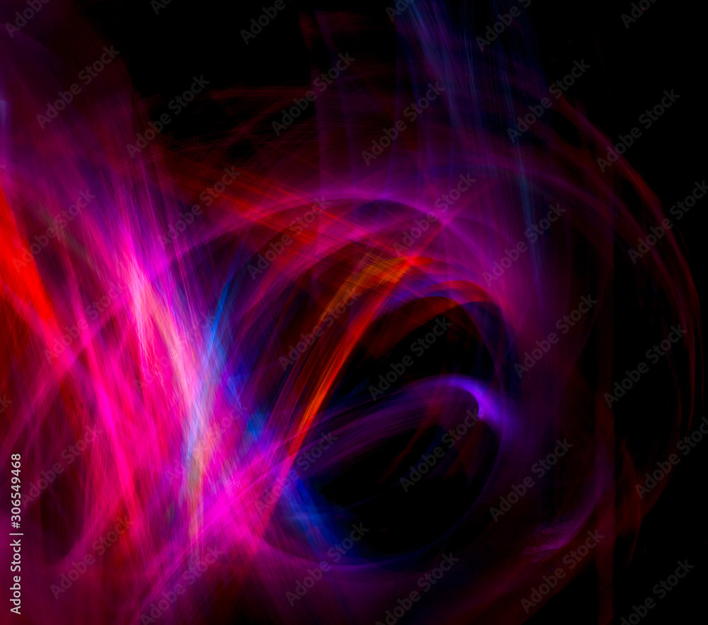 Fototapeta premium Random lines of pink fairy lights in a stream of color, loops and swirls against a black background.