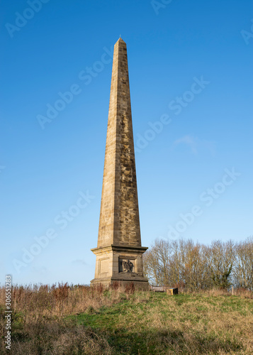 Welcombe Hills, Stratford upon Avon, Warwickshire, England UK - the obelisk/monument on the summit against a clear blue sky. photo