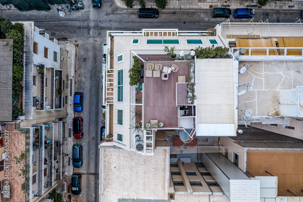 Overhead aerial drone shot of roof patio in west Athens in sunny summer