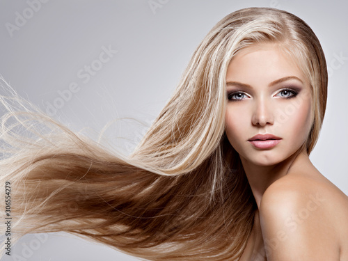 Beautiful young woman with long straight white hair