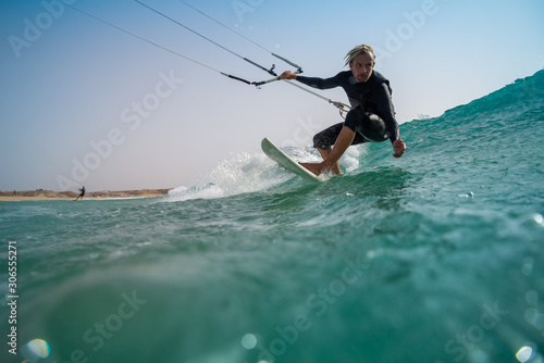 The kite surfer rides the waves of the Atlantic Ocean