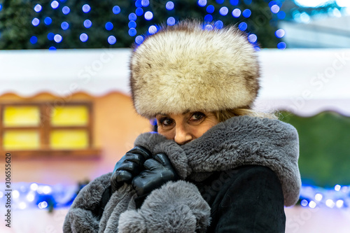 Canvas Print portrait of attractive mature woman while shopping in a department store