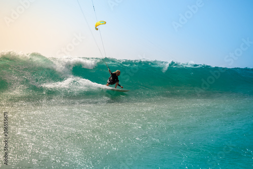 The kite surfer rides the waves of the Atlantic Ocean