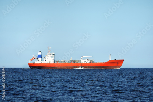 View of a red lpg tanker sailing in a open sea on a clear day