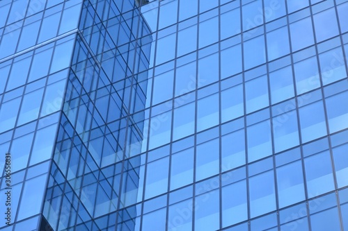 Abstract texture of blue glass modern building skyscrapers. Business background.