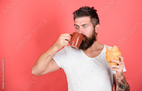 favorite breakfast. Bearded hipster enjoy breakfast drink coffee. Morning tradition concept. Fresh baked croissant. Delicious breakfast. Unhealthy but yummy breakfast. Perfect match. feel hunger