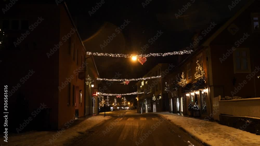 Main street in a small town decorated for Christmas and New Year - tilting up Main street in a small town decorated for Christmas and New Year - tilting up