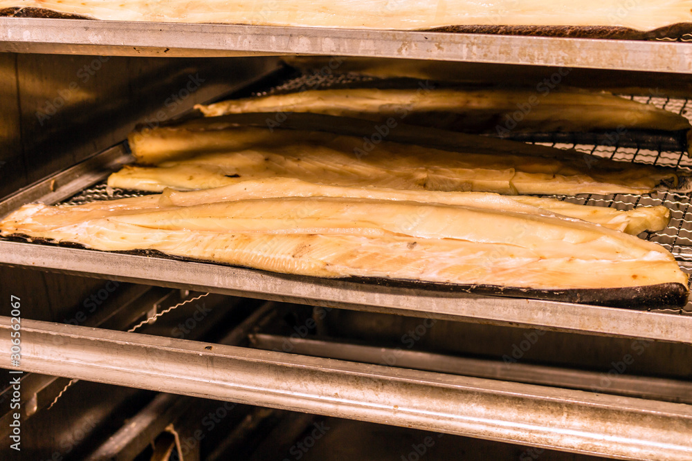 Hot smoked fish. Fish production in progress Hot smoked fish. Fish production in progress