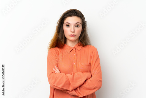 Young brunette girl over isolated white background feeling upset