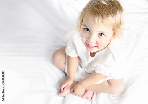 Caucasian child in white smiling portrait,healthy lifestyle,health care concept.