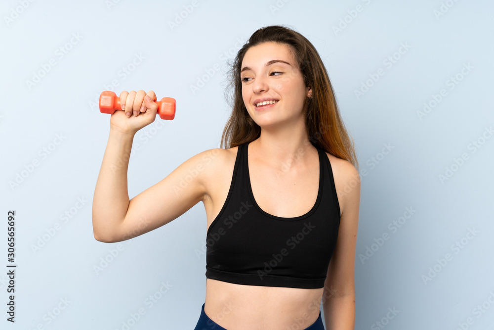 Young sport woman with weightlifting over isolated blue background with happy expression Young sport woman with weightlifting over isolated blue background with happy expression