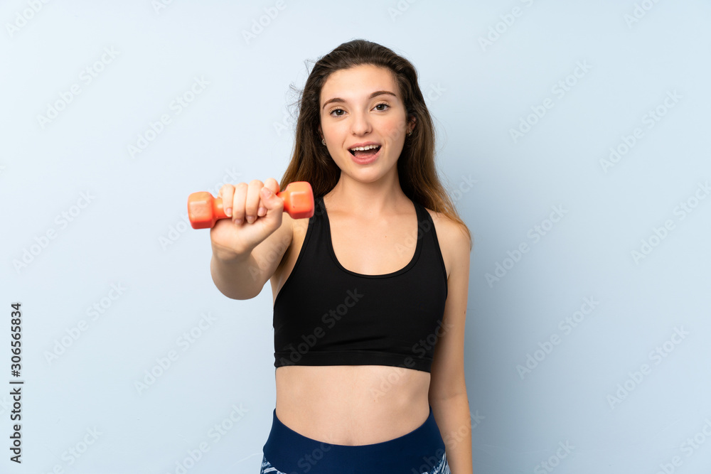 Young sport woman with weightlifting over isolated blue background with happy expression Young sport woman with weightlifting over isolated blue background with happy expression