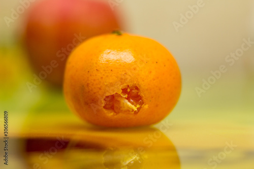 Bitten tangerine. Photo.