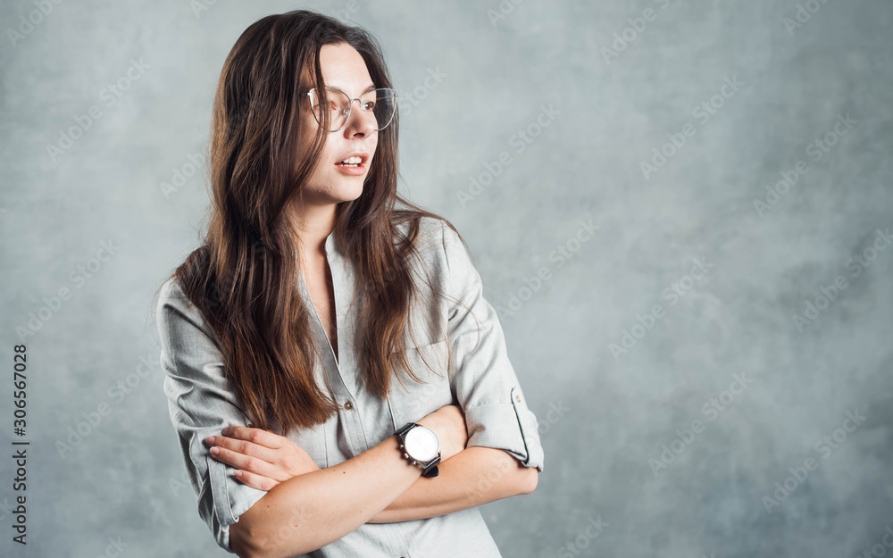 Young brunette woman in glasses, self-confidence. Smiling and calm girl Young brunette woman in glasses, self-confidence. Smiling and calm girl