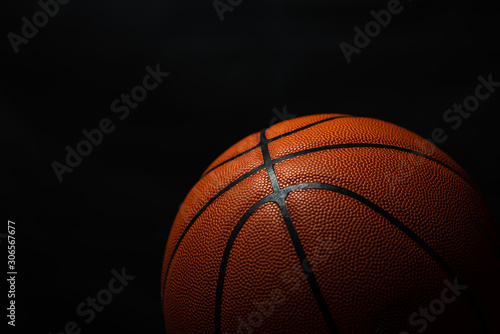 Basketball under the light with a black background