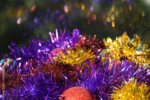 Multicolored Christmas tinsel and balls background