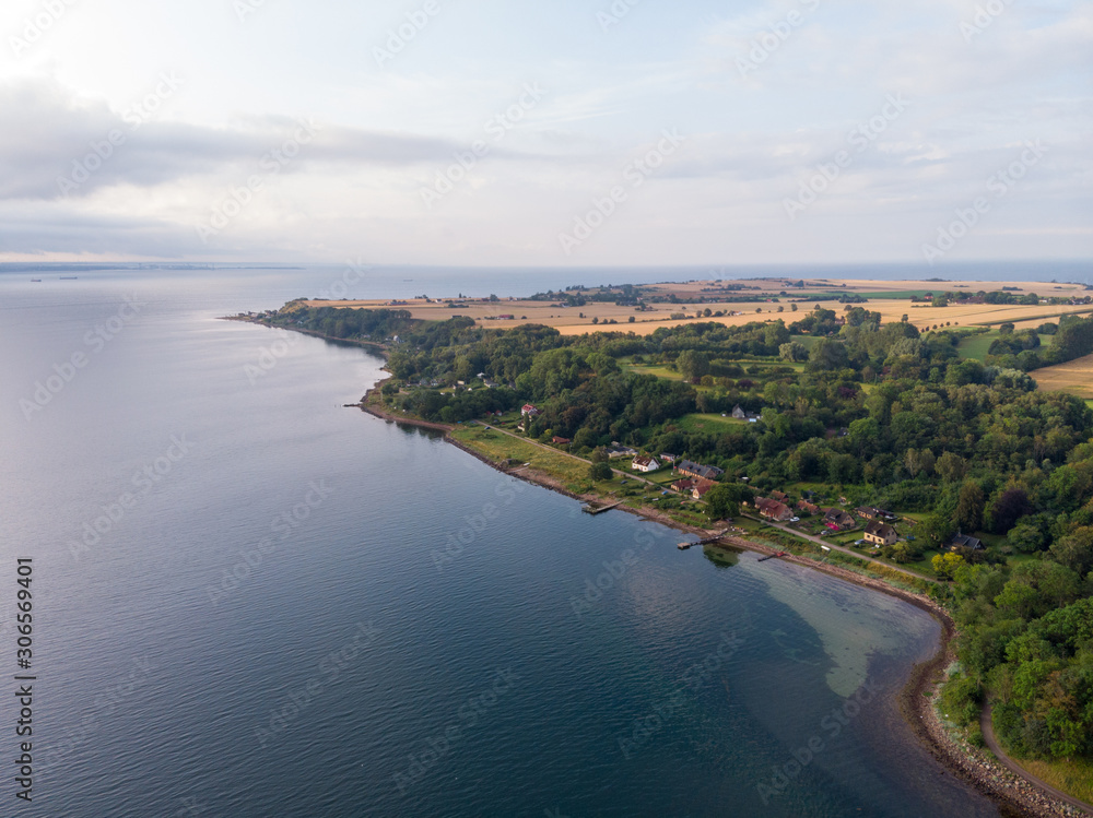 Aerial view of Husvik on the island Ven in southern Sweden during a summer sunrise. 
