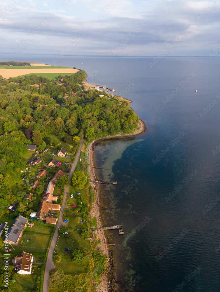 Aerial view of Husvik on Ven island in southern Sweden an early morning in summer during sunrise. 