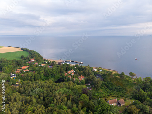 Aerial view of Norreborg harbor on the island of Ven in southern Sweden during a summer sunrise © Viktorishy