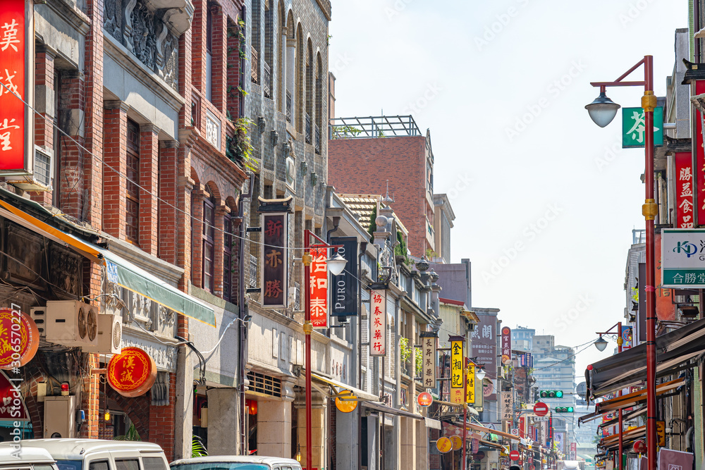 Fototapeta premium Dihua Street Market in Taipei, Taiwan, famous tourist attraction, people can seen walking and exploring around it. The street is a major destination during Chinese New Year festivities