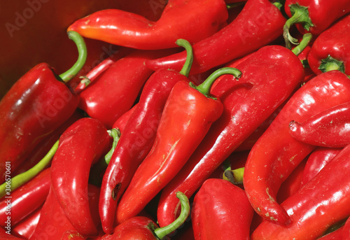 Heap of fresh ripe red sweet chili peppers for sale at the local market in Georgia