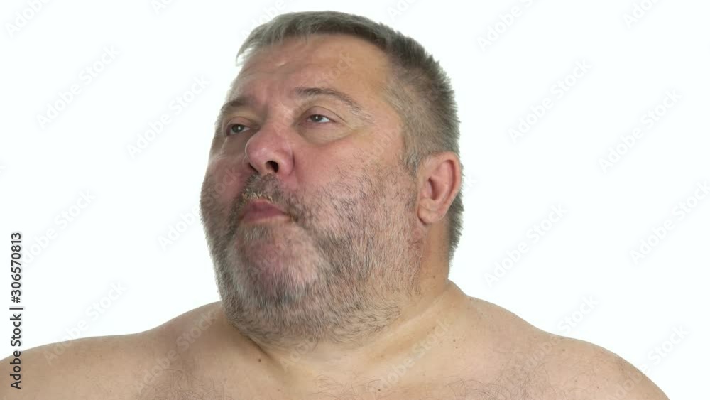 Portrait of fat man enjoying breakfast. Satisfied obese guy chewing food on white background close up. Overeating leads to health problem. Portrait of fat man enjoying breakfast. Satisfied obese guy chewing food on white background close up. Overeating leads to health problem.