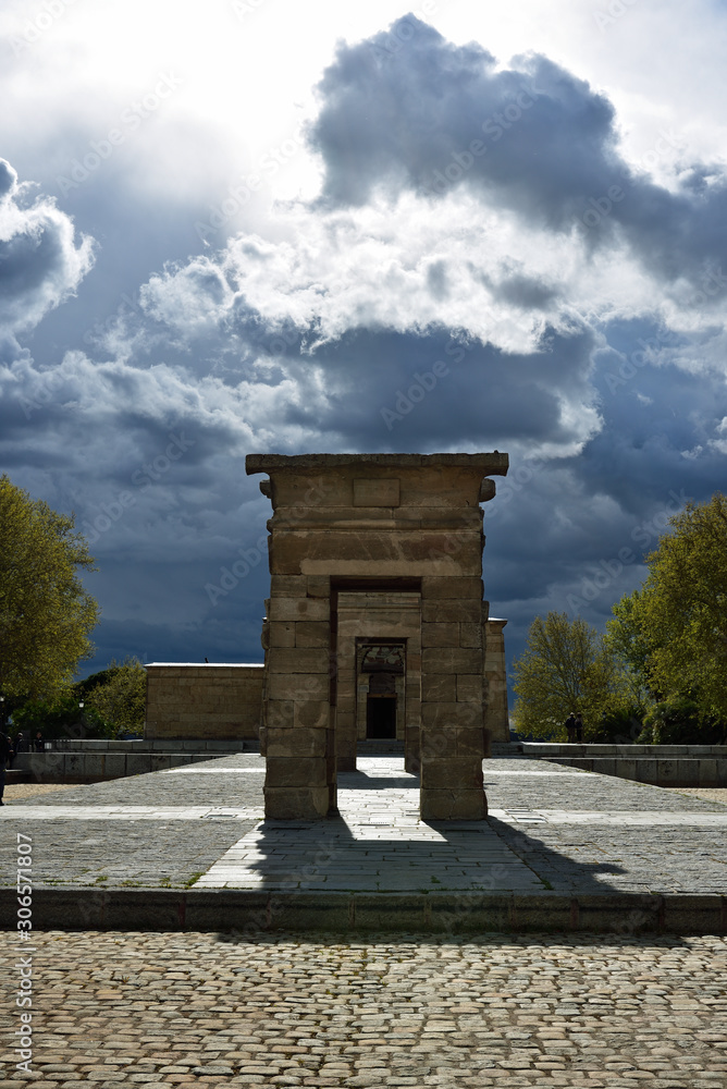 Madrid Templo de Debod ancient Egyptian temple with dramatic storm clouds in the sky on early Madrid spring, Spain