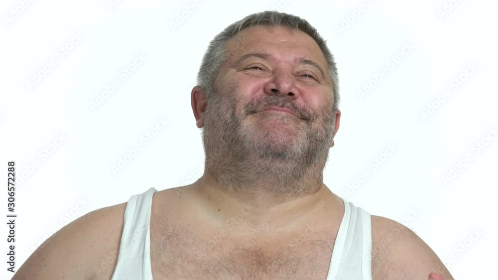 Delighted overweight man drinking beer. Portrait of happy fat man drinking alcohol beverage on white background. Delighted overweight man drinking beer. Portrait of happy fat man drinking alcohol beverage on white background.
