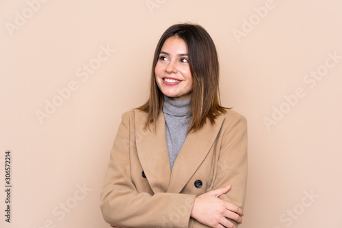 Young woman over isolated background laughing