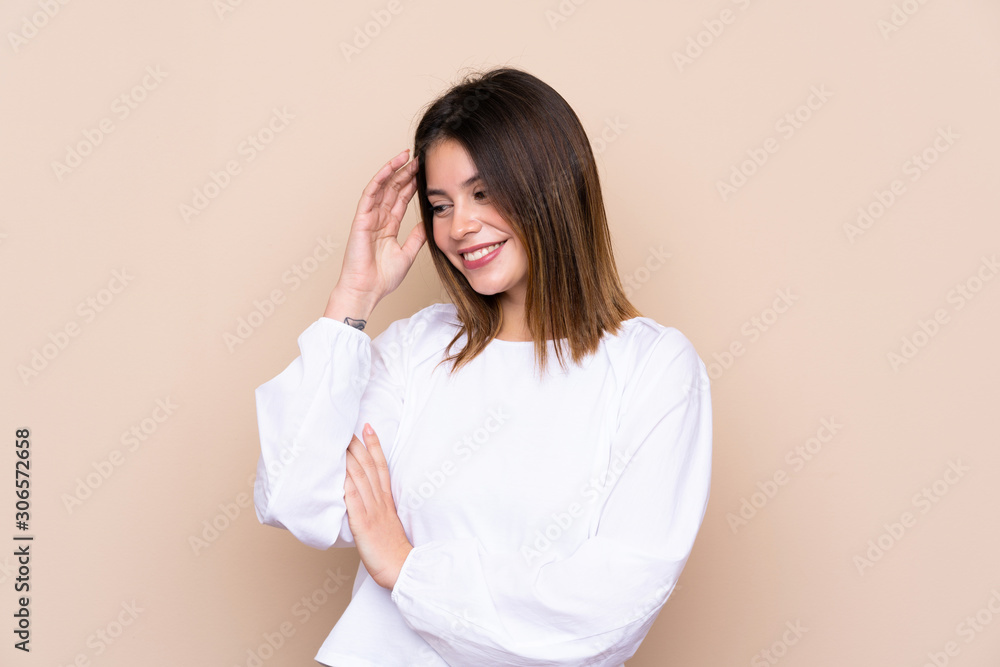 Young woman over isolated background laughing Young woman over isolated background laughing