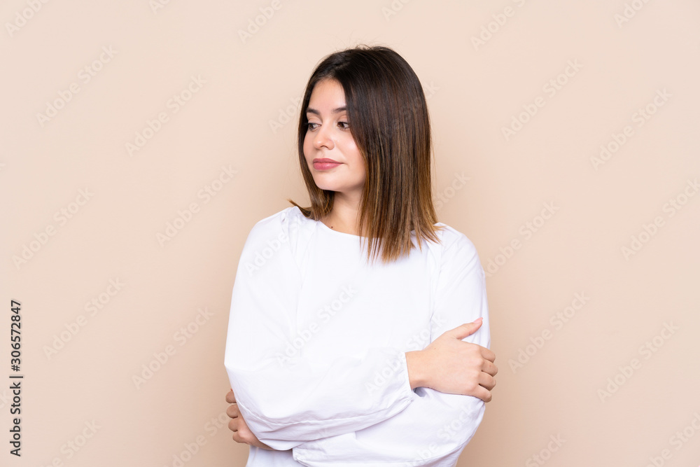 Young woman over isolated background thinking an idea Young woman over isolated background thinking an idea