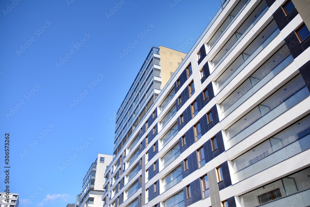 Fragment of modern residential apartment with flat buildings exterior. Detail of new luxury house and home complex. 