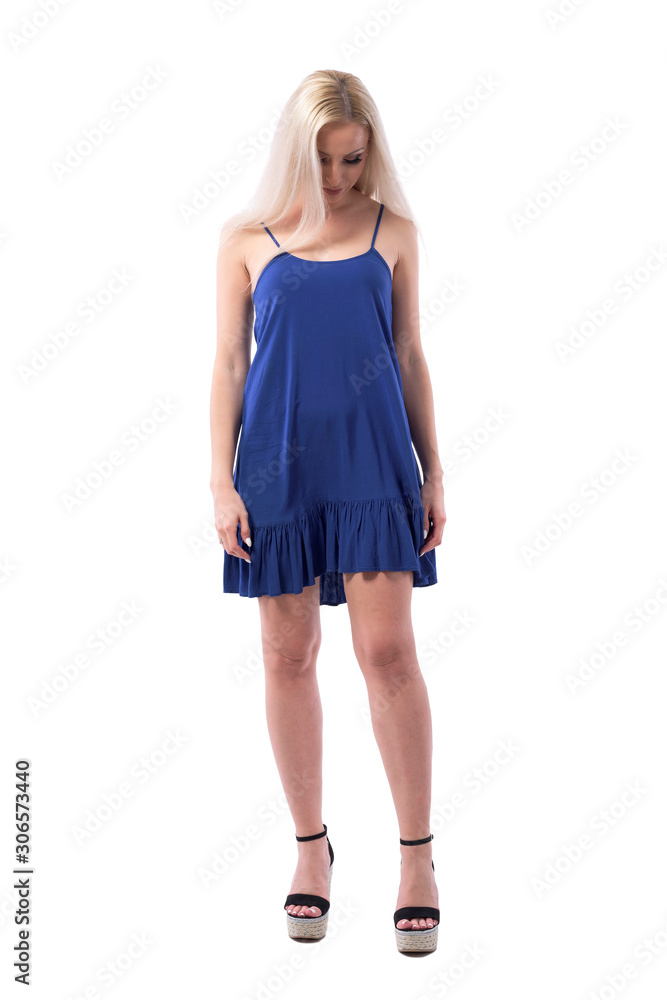 Young elegant blonde woman in nightie or sleeping dress looking down with hair covering her face. Full body isolated on white background. Young elegant blonde woman in nightie or sleeping dress looking down with hair covering her face. Full body isolated on white background.