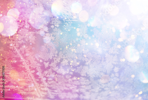 Christmas and New Year holidays background with frost patterns. Glitter lights backdrop. Winter season. Text space.