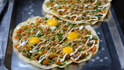 Vietnamese night market, Selective focus.  Close up photo of a traditional Vietnamese banh bao steamed bun with pork filling at a street food market.