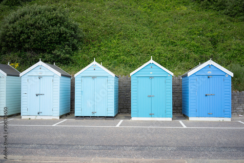 Colorful Beach huts, in blue colors, at the  boulevard in Bournemouth, Dorset, UK, England on a cloudy day in summer © Leoniek