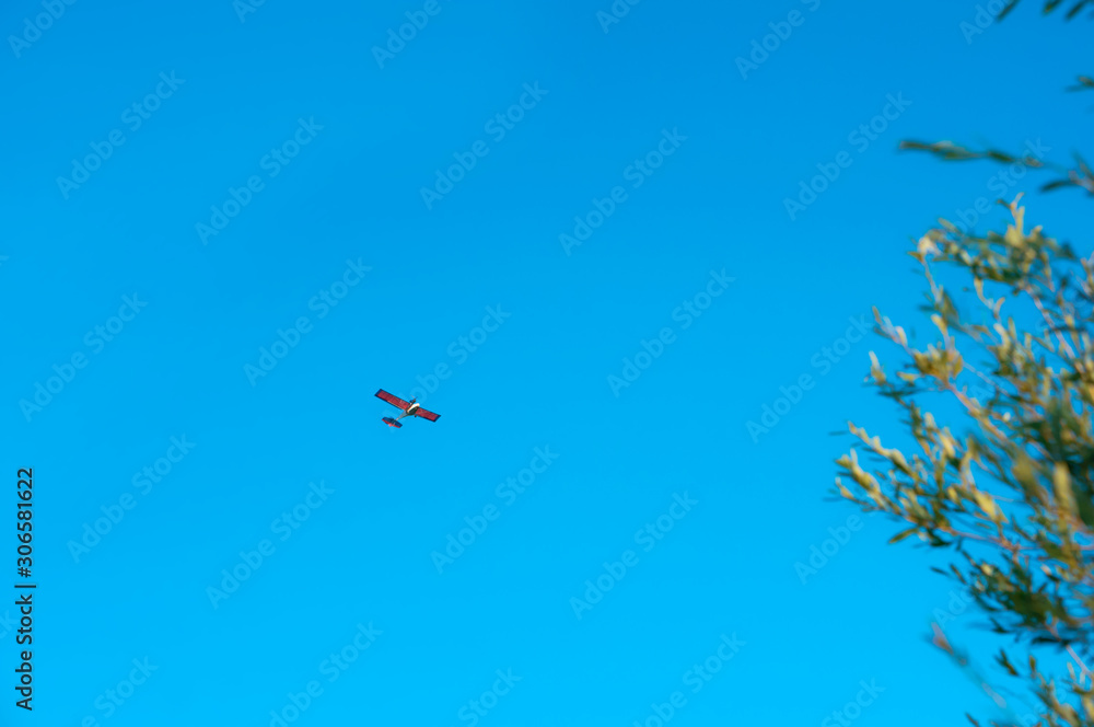 Blue sky and airplanes. Small plane in the sky.