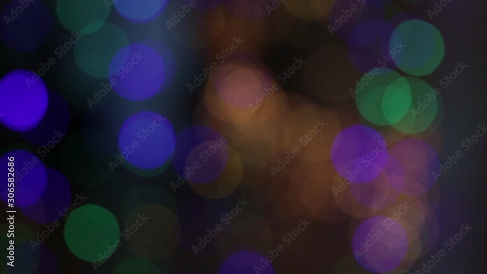 a group of blinking blurry lights of red, yellow, green and blue a group of blinking blurry lights of red, yellow, green and blue