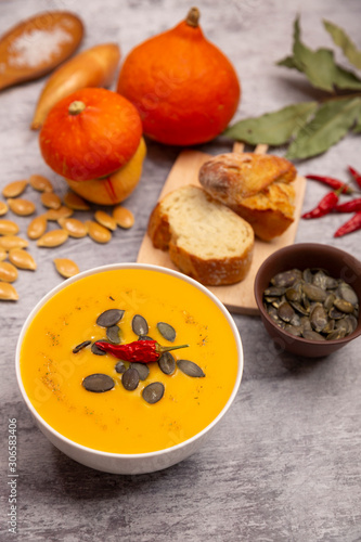Pumpkin soup with seeds and pepper.