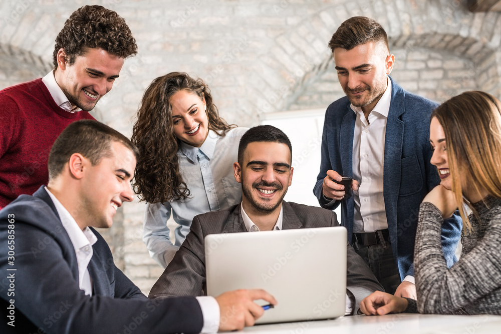 Group of business people discussing and working together during a meeting in office Group of business people discussing and working together during a meeting in office