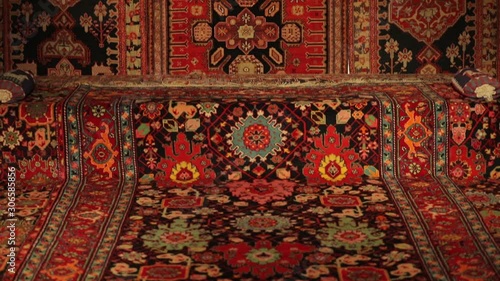 Large oriental rug with colorful patterns. Handmade rug production, carpet close-up with all the details